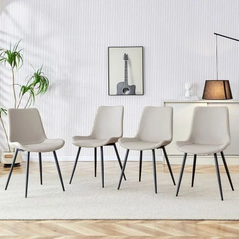 Set di 4 sedie da pranzo in similpelle: design moderno con seduta e schienale ampi e piedini in metallo antiscivolo, ideali per casa e ufficio.